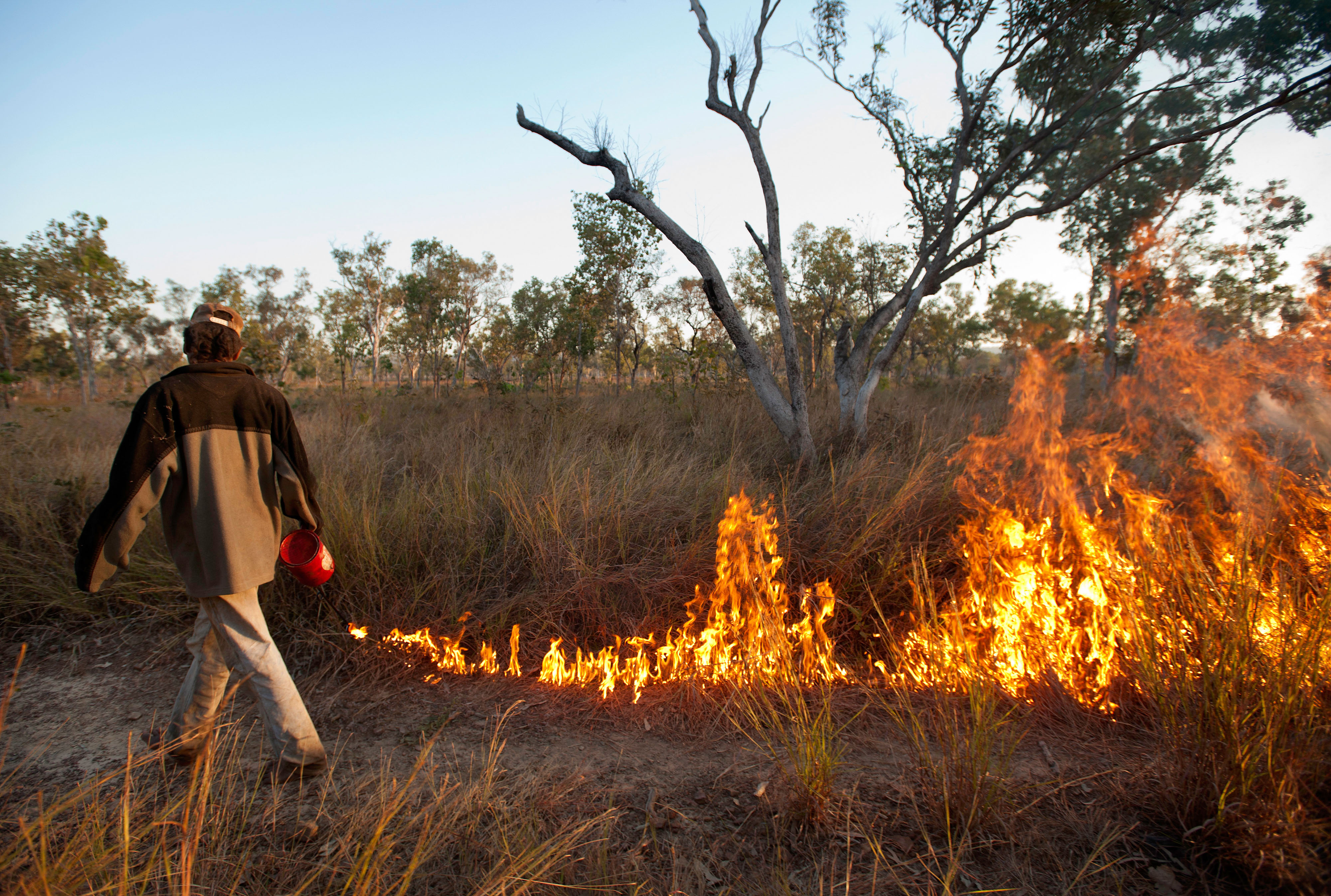 man tending to a controlled burn