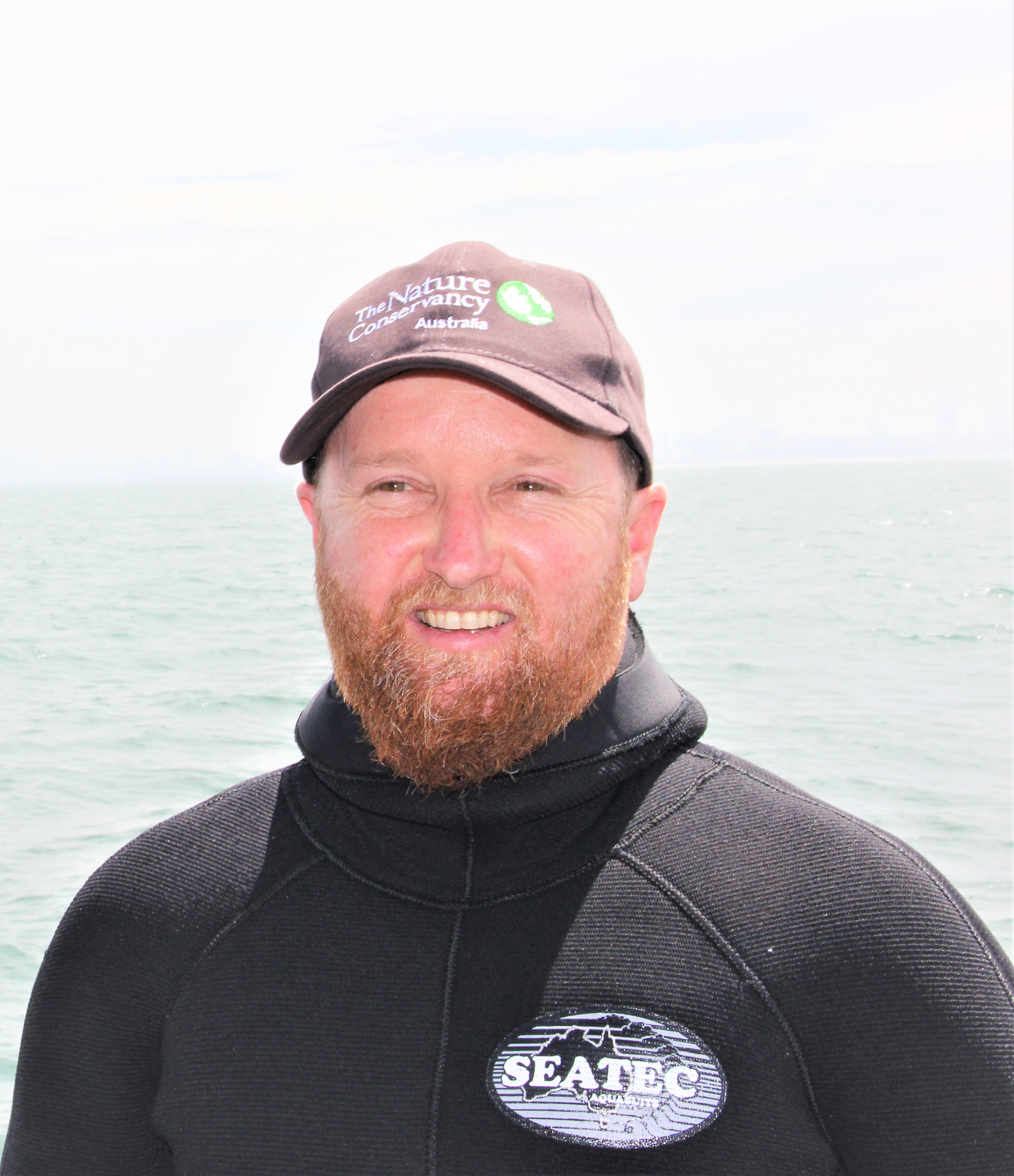 man in black by the ocean